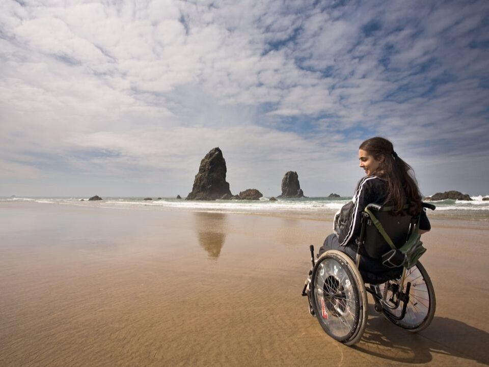 girl on beach wheelchair